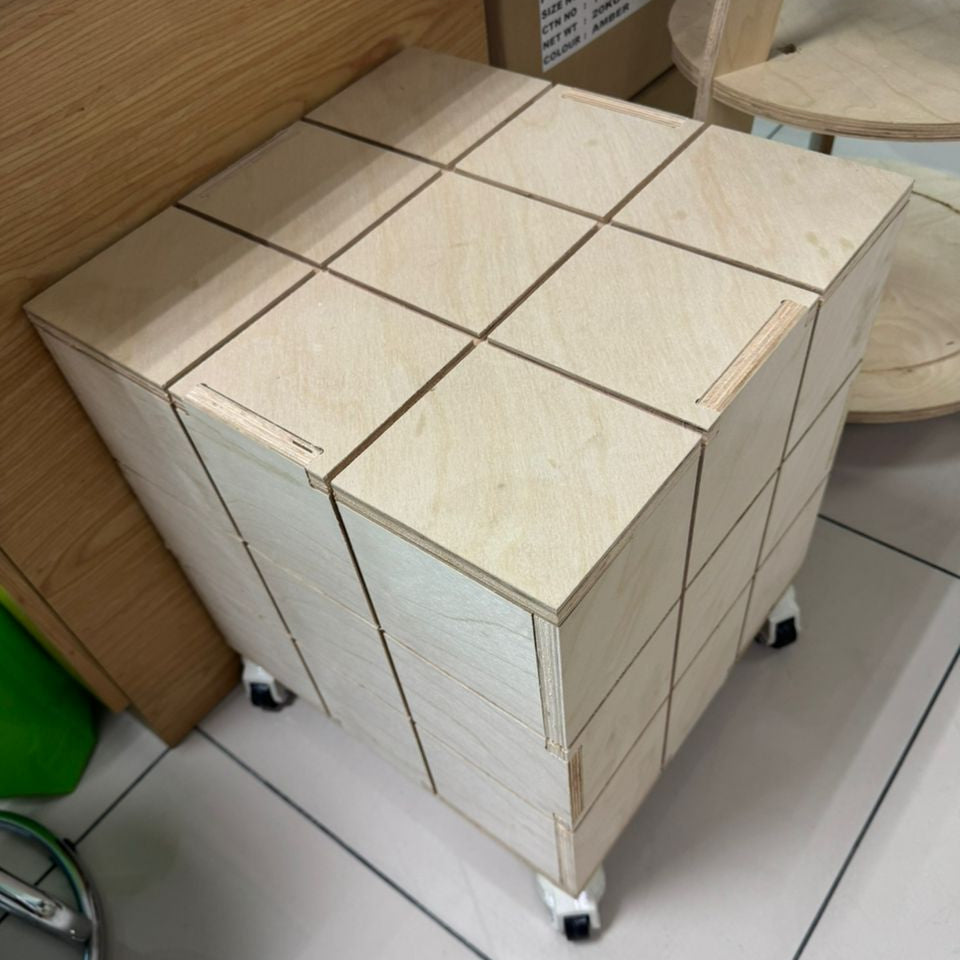 Wooden storage unit with tiled top on a tiled floor