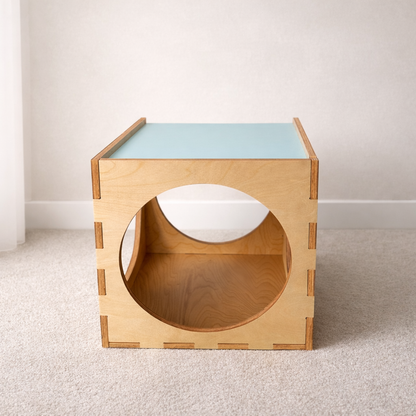 Wooden side table with a light blue top on a neutral background